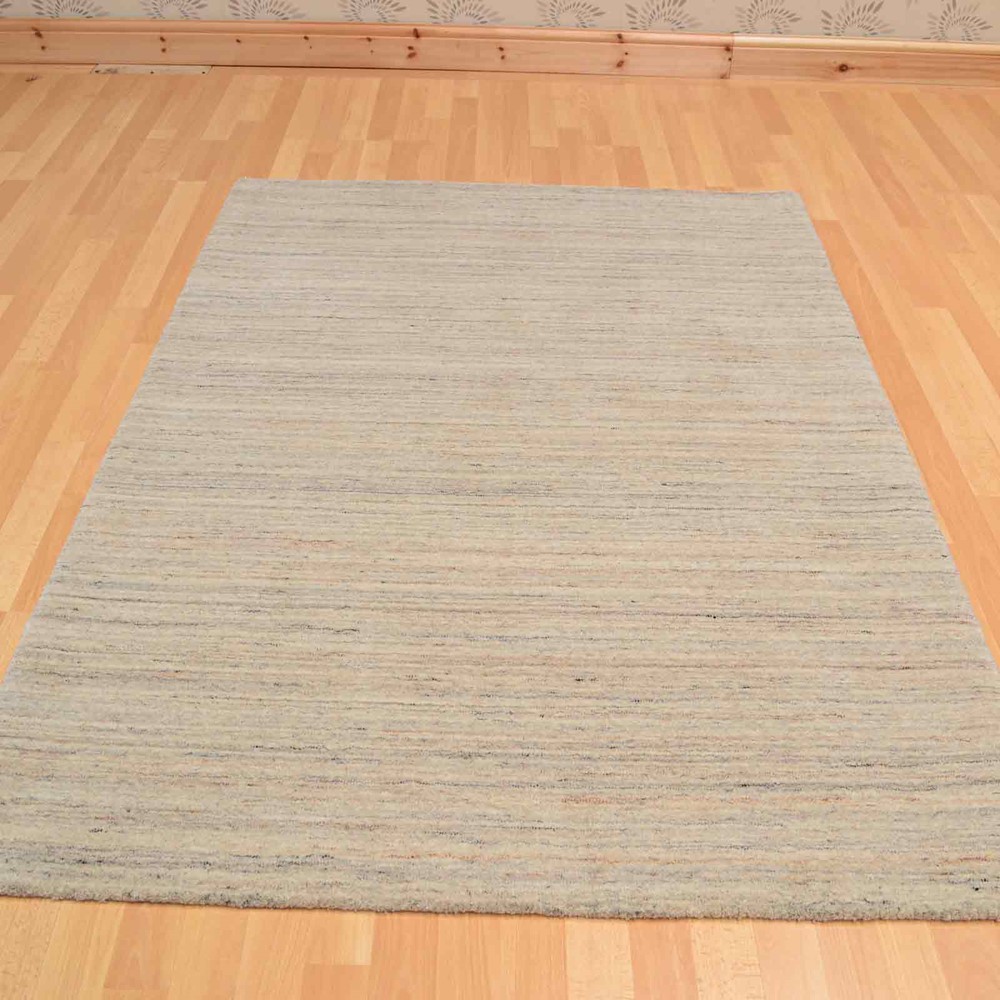 Plain Abrash Wool Rugs in Ivory buy online from the rug seller uk